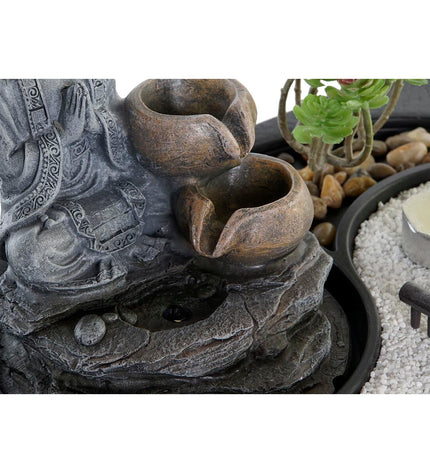 Two DKD Home Decor Buddha fountain ornaments for outdoor garden decoration, measuring 29 x 21 x 23 cm, in a natural setting.