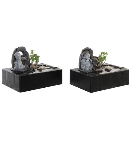 Two DKD Home Decor Buddha fountain sculptures for outdoor garden decor, measuring 29x21x23 cm each, with oriental design accents.