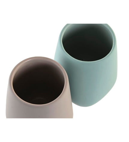Set of two DKD Home Decor toothbrush holders in green and beige dolomite, 8x8x11 cm, for bathroom organization.
