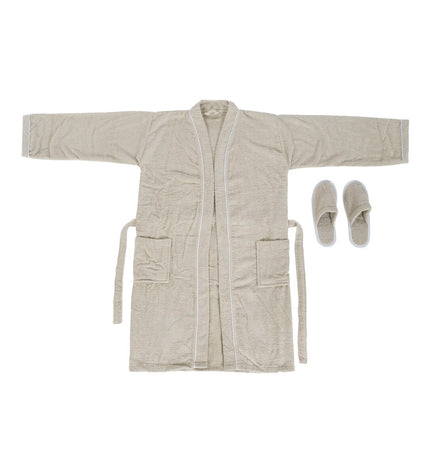 Beige Home ESPRIT bathrobe for women made of 400 g/m² terry cloth, shown hanging in a bathroom setting.