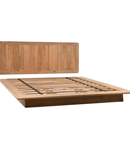 Home ESPRIT bed in 180x200 cm with a wooden frame and headboard, shown in a modern bedroom setting.