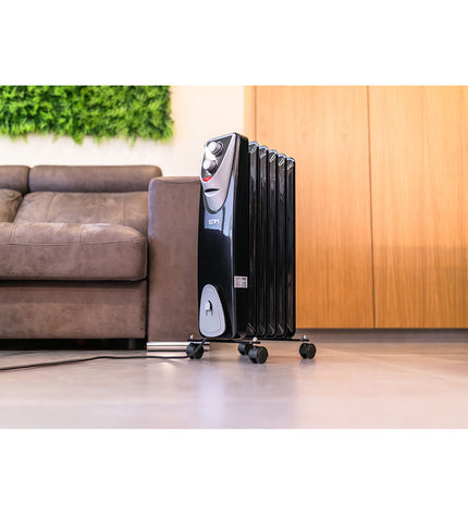 Black and gray EDM 1000W portable heater with digital controls, ideal for home heating and cooling.