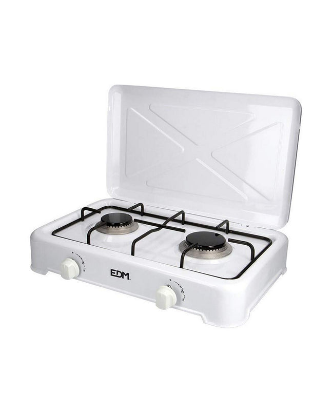 EDM gas stove for camping and outdoor use, compact 46x30x12 cm with four burners and control knobs, in a natural outdoor setting.
