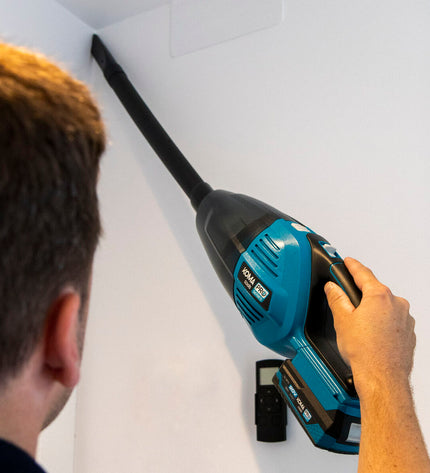 Koma Tools Pro Series kruimelzuiger in zwart en geel, compact design, suitable for home cleaning and surface maintenance.