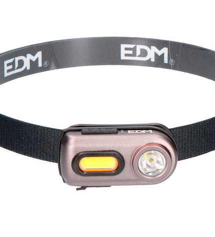 Black LED headlamp EDM 36416 with 5W for outdoor activities like camping and hiking, showing the lamp worn on a head.