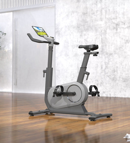 Refurbished Nexgim stationary bike with Bluetooth 5.0, suitable for fitness and outdoor training, shown with digital display and handlebars.