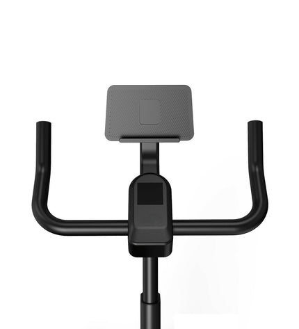 KSIX Bluetooth stationary bike for fitness and outdoor training, with adjustable seat and modern digital display.