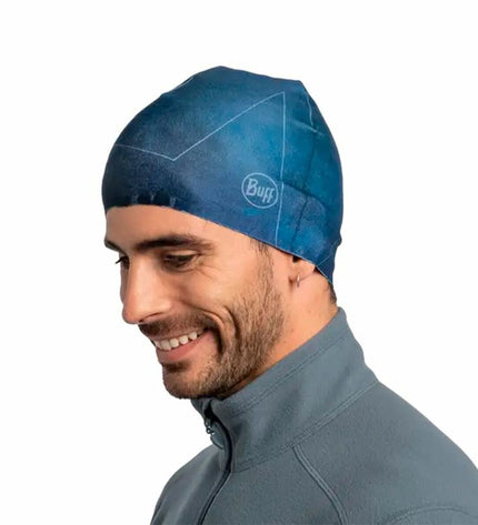Buff Thermonet blue buff, versatile outdoor headwear for camping and hiking, showing its soft, thermal fabric and blue color.