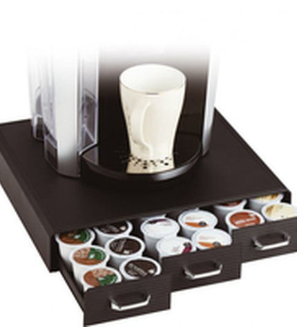 Black Archivo 2000 coffee capsule organizer in polyestyreen with multiple compartments for storing coffee capsules.