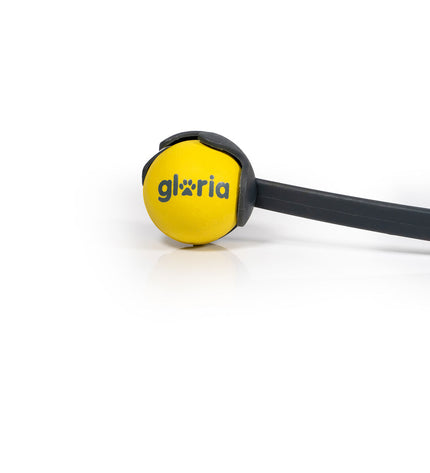 Yellow Gloria dog ball launcher made of durable polypropylene and TPR, designed for interactive play with dogs.