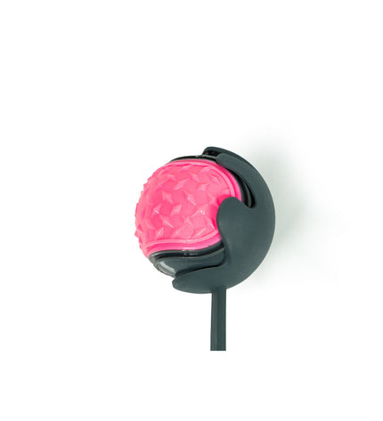 Pink Gloria dog ball launcher made of durable polypropylene and TPR, designed for interactive play with dogs.