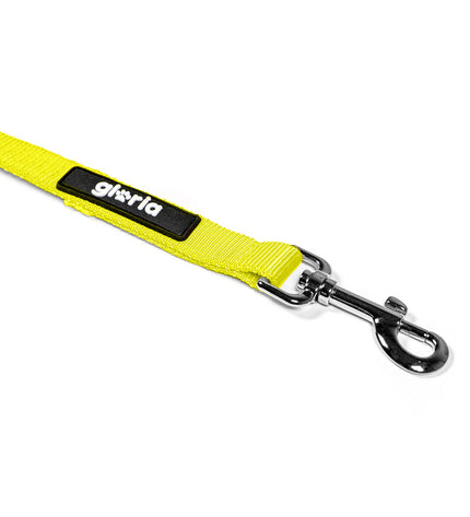 Yellow Gloria dog leash with padded handle and metal clip, designed for comfortable control during walks.