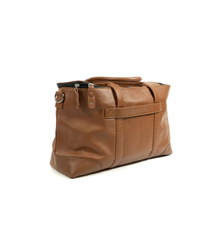 Brown Gloria dog pet handbag with a structured design, featuring handles and a spacious interior for pet comfort and style.