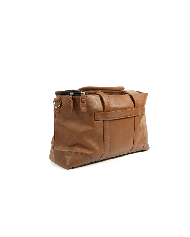 Brown Gloria dog pet handbag with a structured design, featuring handles and a spacious interior for pet comfort and style.