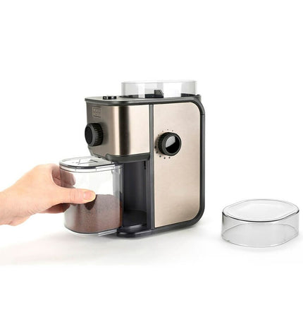 Black & Decker BXCG151E coffee grinder in black, showing the compact appliance with a transparent lid and control buttons.