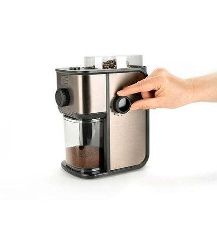 Black & Decker BXCG151E coffee grinder in black, showing the compact kitchen appliance with a clear lid and grinding chamber.