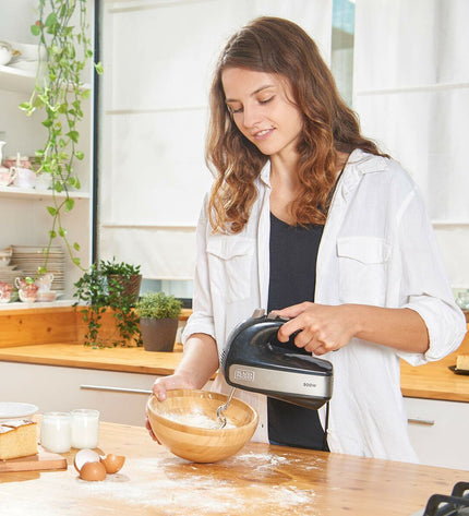 Black & Decker BXMX500E 500W blender and dough mixer on countertop, black compact kitchen appliance for blending and mixing.