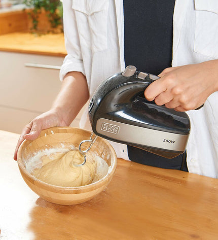 Black & Decker BXMX500E 500W blender and dough mixer showing black appliance with control dial and mixing attachments.