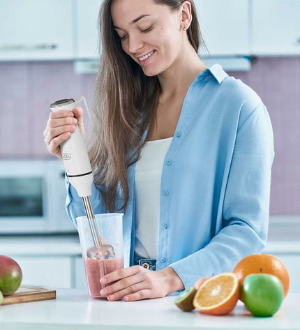 Black & Decker handheld blender in black, with blending shaft and control buttons, suitable for kitchen and cooking use.