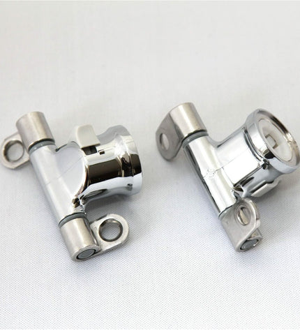 Pair of Roca Dama Senso toilet hinges for bathroom and kitchen, featuring durable metal construction and easy installation.