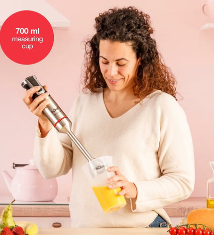Solac BA5618 handblender with stainless steel blending arm and control buttons, used for cooking and kitchen tasks.