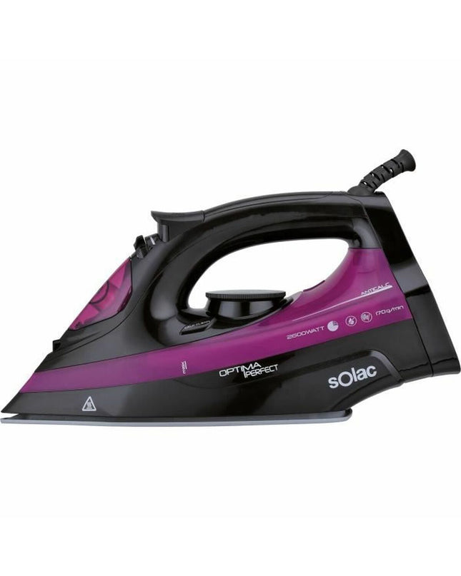Solac PV2114 steam iron with water reservoir and control dial, lying on a white ironing board.