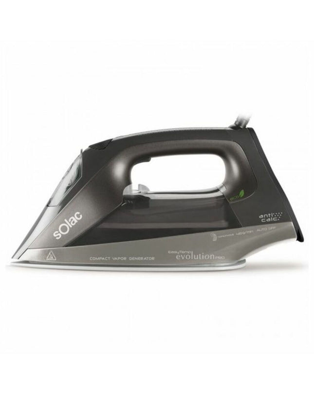 Solac S91868300 steam iron with 2400W power, steam output 45g/min, in white and gray, on a ironing board.