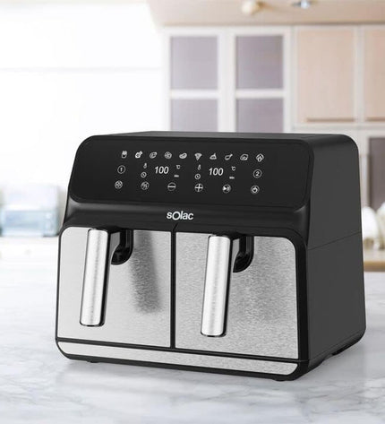 Black Solac FA1520 air fryer with 1700W power and 8L capacity, shown on a kitchen countertop with digital controls.