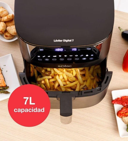 Black Solac FA1521 air fryer with 7-liter capacity, 1650W, shown on a kitchen countertop.