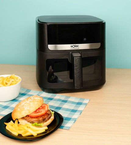 Black Solac FA1801 air fryer for home cooking, compact electric kitchen appliance with digital controls and sleek design.