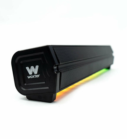 Black Woxter SO26-103 wireless soundbar with sleek design and audio controls, ideal for enhancing home entertainment systems.