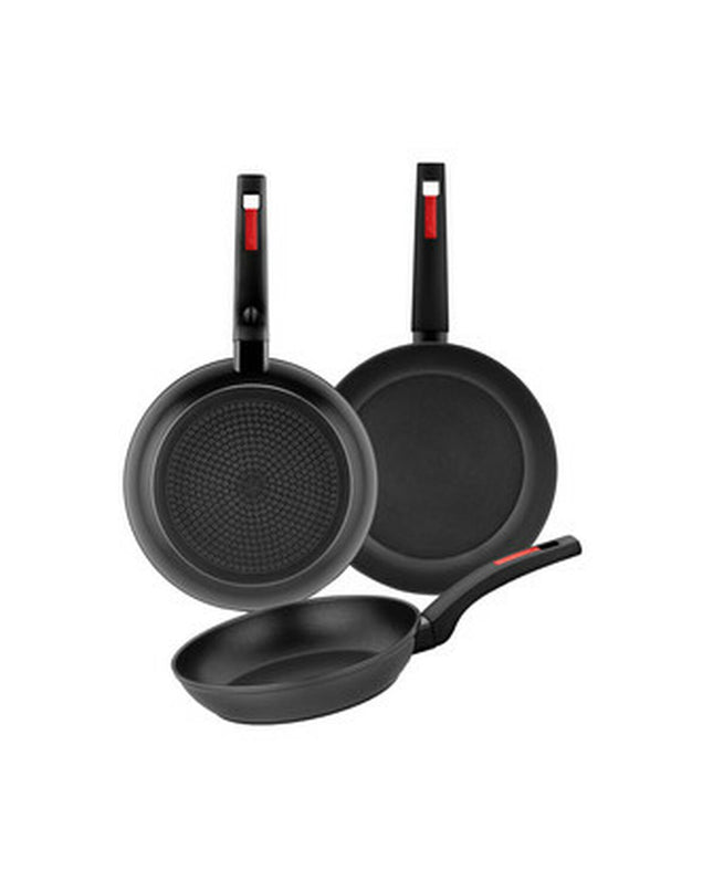 Black plastic Monix M249001 3-piece pan set for kitchen and home cooking, with visible handles and lid components.