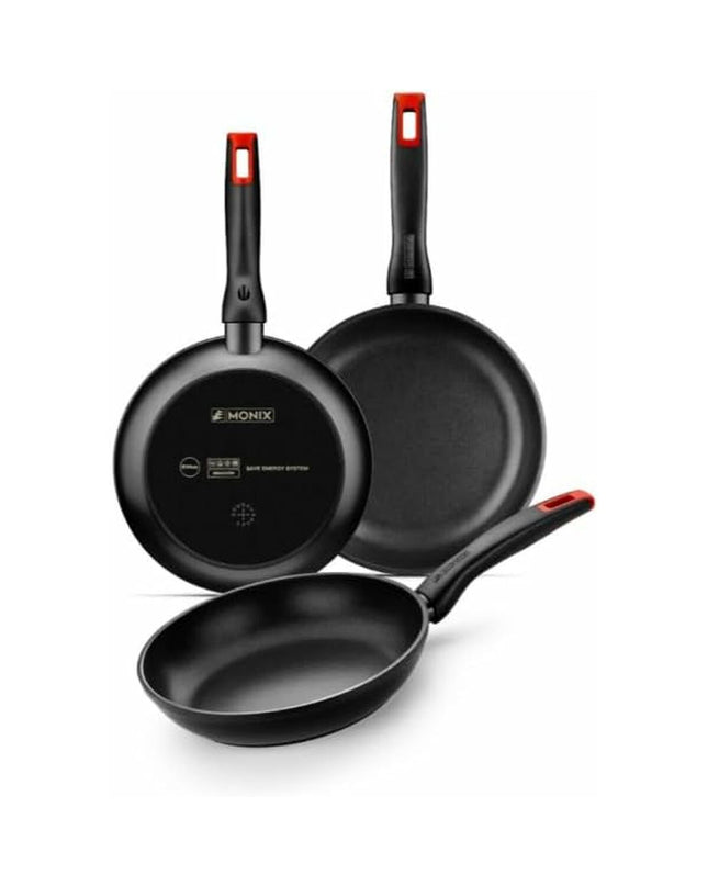 Monix PRO Zwart cookware set with three black pans for home cooking, featuring non-stick surfaces and ergonomic handles.