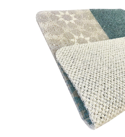 Exma Gomaloop bath mat in house and kitchen, showing textured, absorbent surface in neutral color.