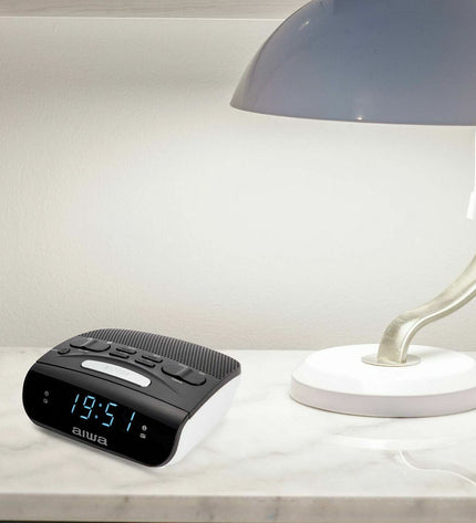 Aiwa CR-15 black radio alarm clock with digital display and control buttons, part of audio and hi-fi electronics.