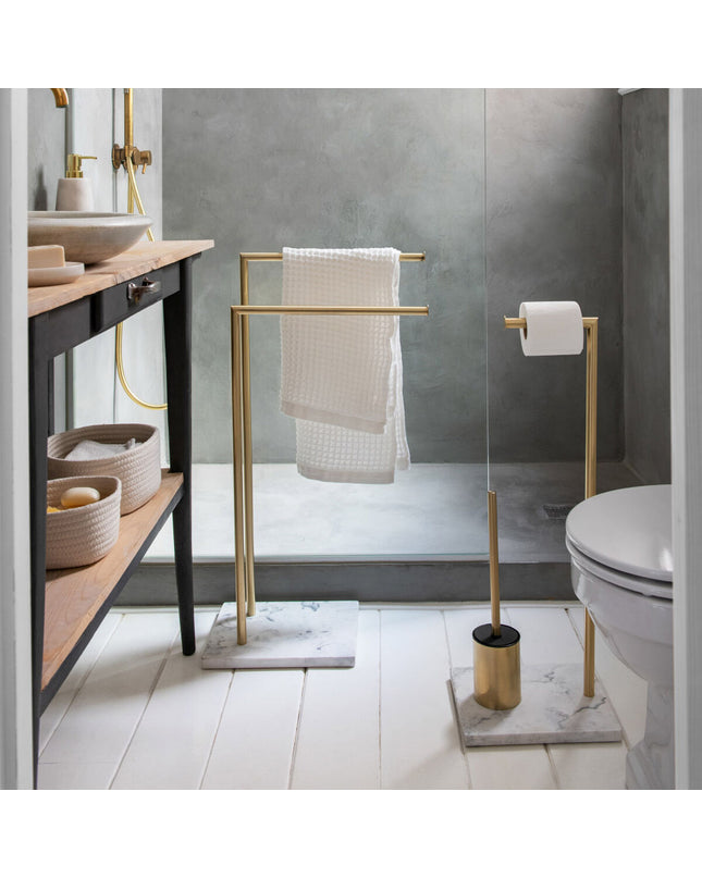 Andrea House toilet paper holder with brush stand in gold, bathroom accessory featuring a sleek design and functional storage.