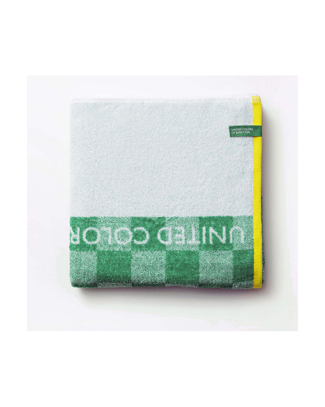 Benetton green beach towel, 140x170 cm, soft cotton, perfect for home, bath, or outdoor use.