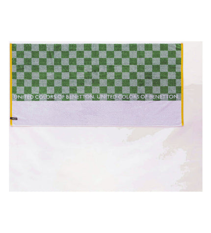 Benetton green beach towel with 140 x 170 cm size, featuring a soft, absorbent fabric for home and bath use.