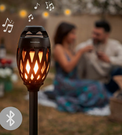 InnovaGoods draadloze speakerphone with LED-vlameffect, designed for outdoor garden decor and outdoor entertainment.