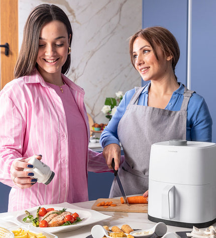 InnovaGoods Fryinn Lite 2000 white air fryer with 2L capacity and 1200W power, designed for quick, healthy cooking.