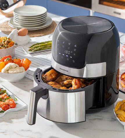 InnovaGoods Fryinn black air fryer with 3.5L capacity and 1400W power, featuring a sleek stainless steel design.