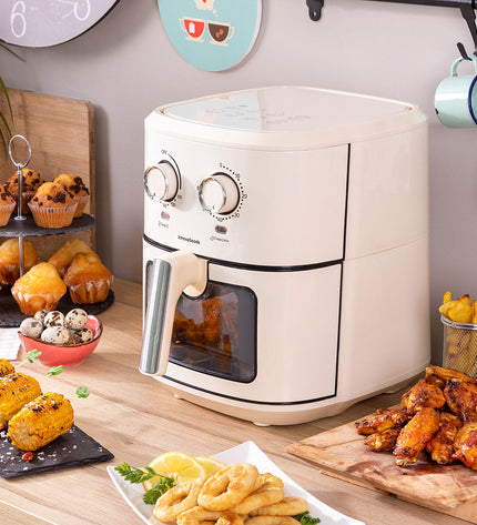 InnovaGoods Vynner Pro 6500 crème air fryer with 6.5L capacity, stainless steel exterior, 1700W, for home cooking.