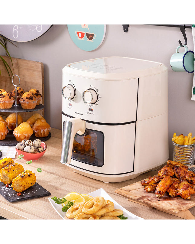 InnovaGoods Vynner Pro 6500 crème air fryer with 6.5L capacity, stainless steel exterior, 1700W, for home cooking.