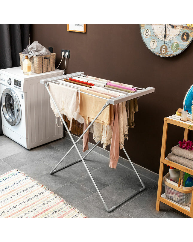 InnovaGoods foldable electric clothes drying rack with 8 bars, 120W, in a home laundry setting.