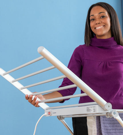 InnovaGoods electric foldable drying rack with wings, 20 bars, 230W for household drying and storage, shown with extended wings.