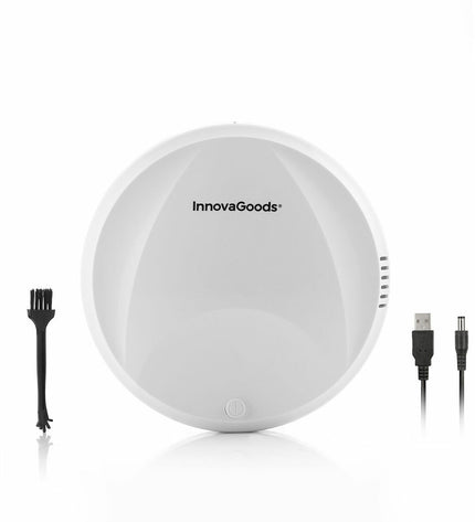 InnovaGoods slimme robotstofzuiger op houten vloer, compact design voor huis en schoonmaak, overzicht van stofzuiger in actie.