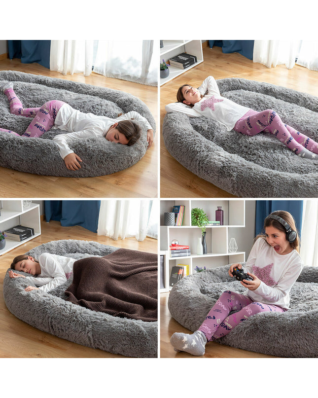 Large grey human dog bed by InnovaGoods with plush fabric and spacious design for comfortable lounging.