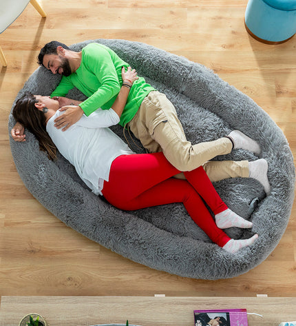 Large grey human dog bed by InnovaGoods, featuring soft fabric and spacious design for comfortable lounging.