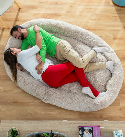 Beige InnovaGoods Human Dog Bed XXL, cozy oversized pet-style furniture for comfort and relaxation.