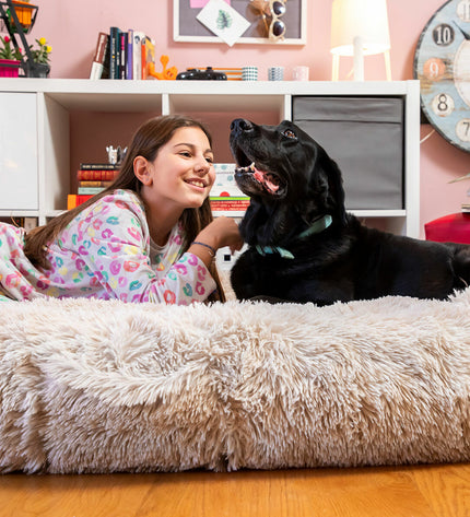 Beige human dog bed by InnovaGoods, XXL size, comfy cushion with plush fabric, designed for relaxing or lounging.